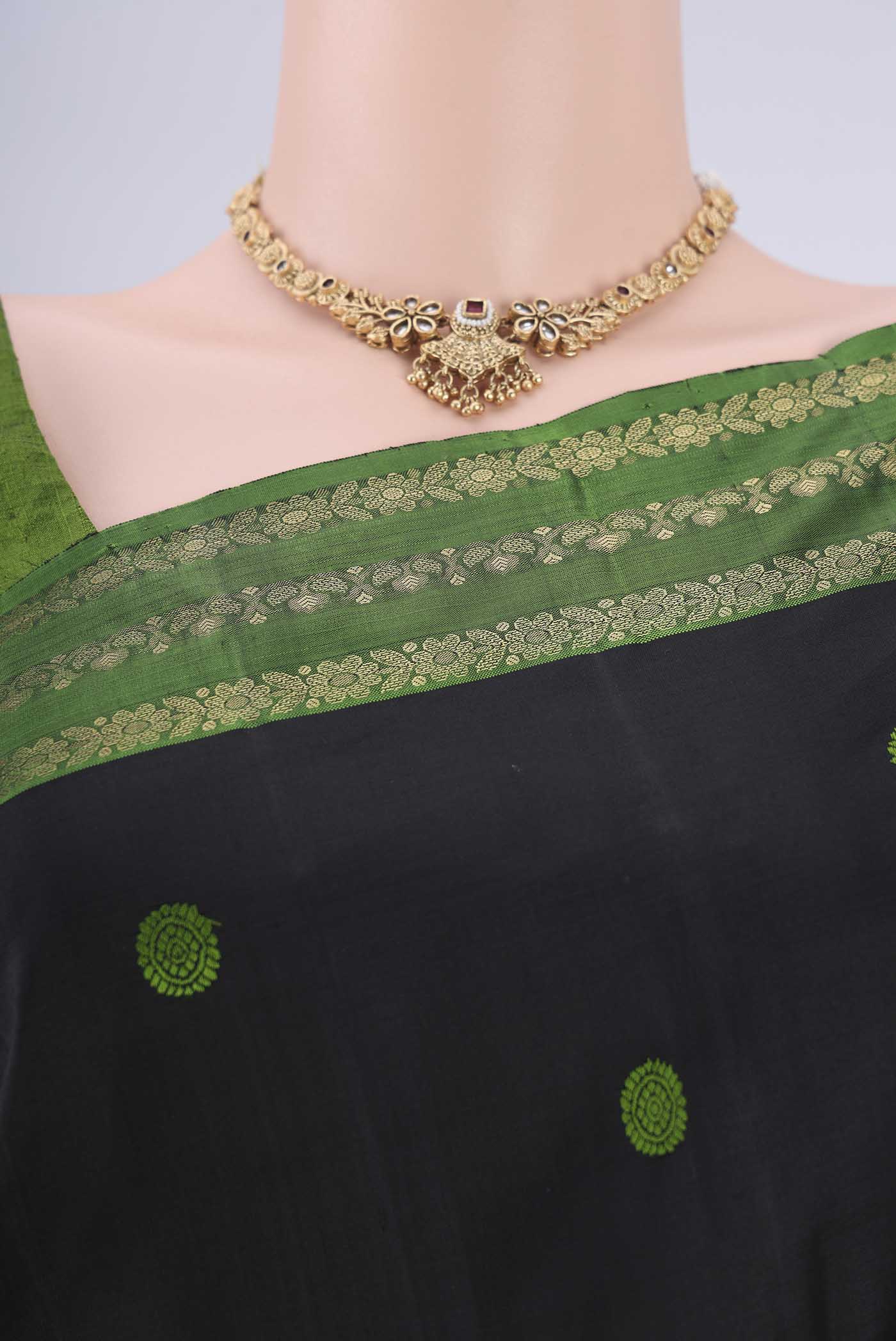 Border image of Black Dual Tone Kanchipuram Silk Saree with Thread Butta on the body and Zari Border. 