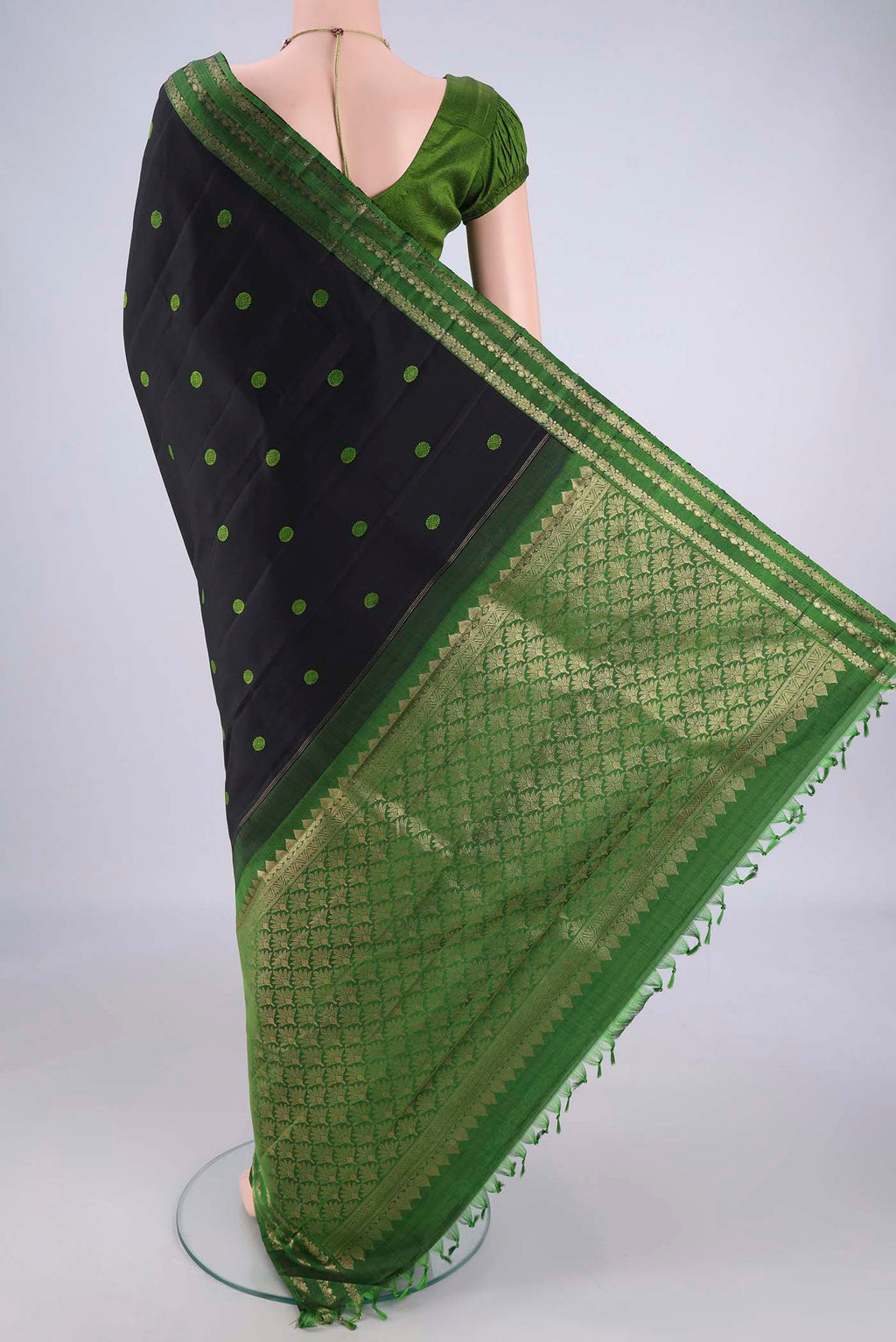 Flat view of Black Dual Tone Kanchipuram Silk Saree with Thread Butta on the body and Zari Border. 