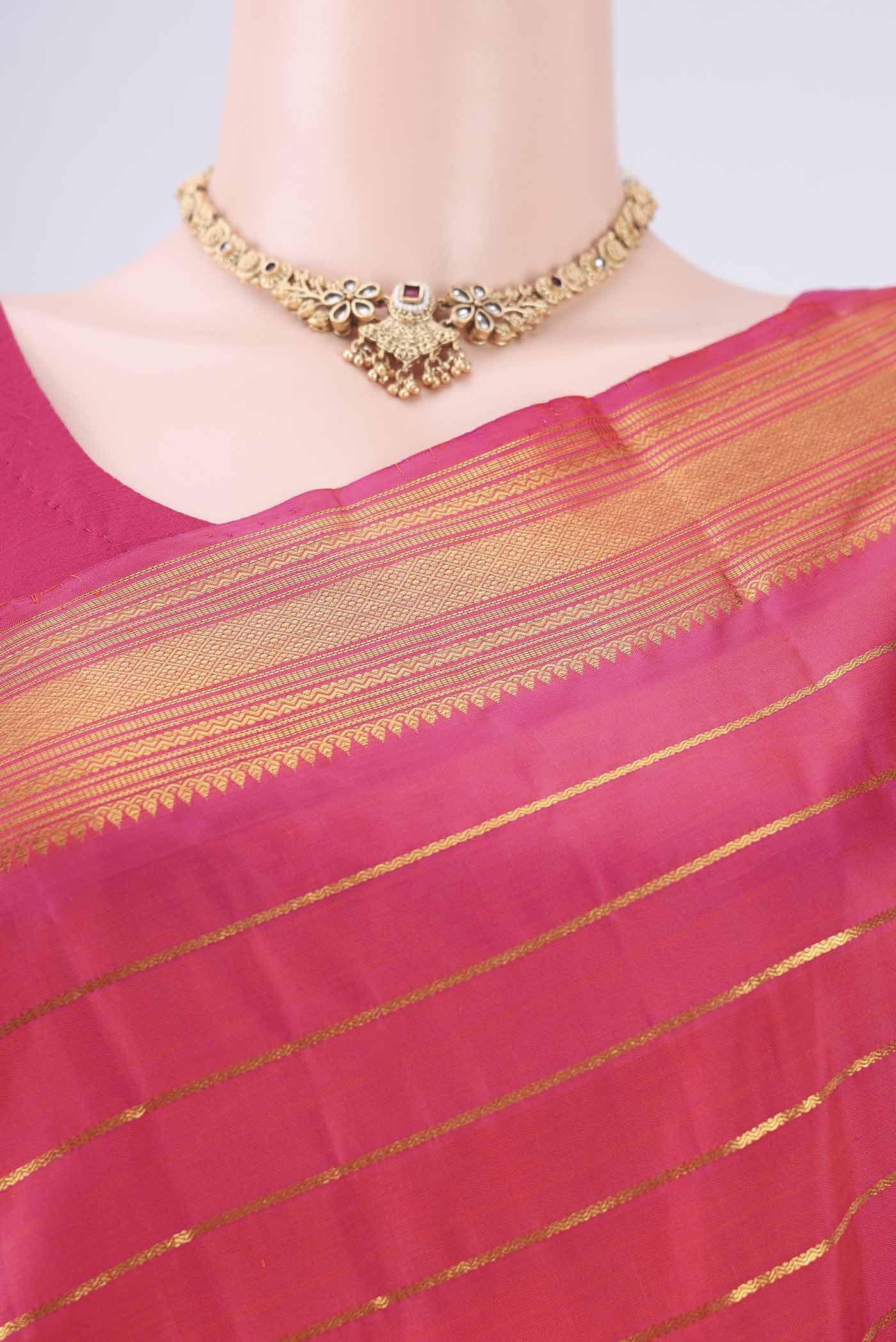 Border image of Dark Pink Kanchipuram Silk Saree with Stripes on the body and Thin Zari Line. 
