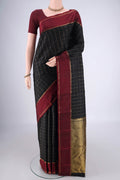 Black Kanchipuram Silk Saree with Checked design on the body and Thin Zari Line.  displayed on a mannequin
