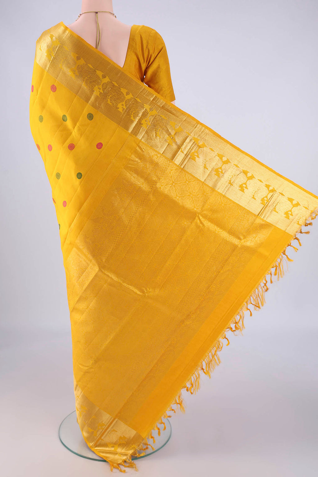 Flat view of Mustard Dual Tone Kanjivaram Silk Saree with Thread Butta on the body and Zari Border. 