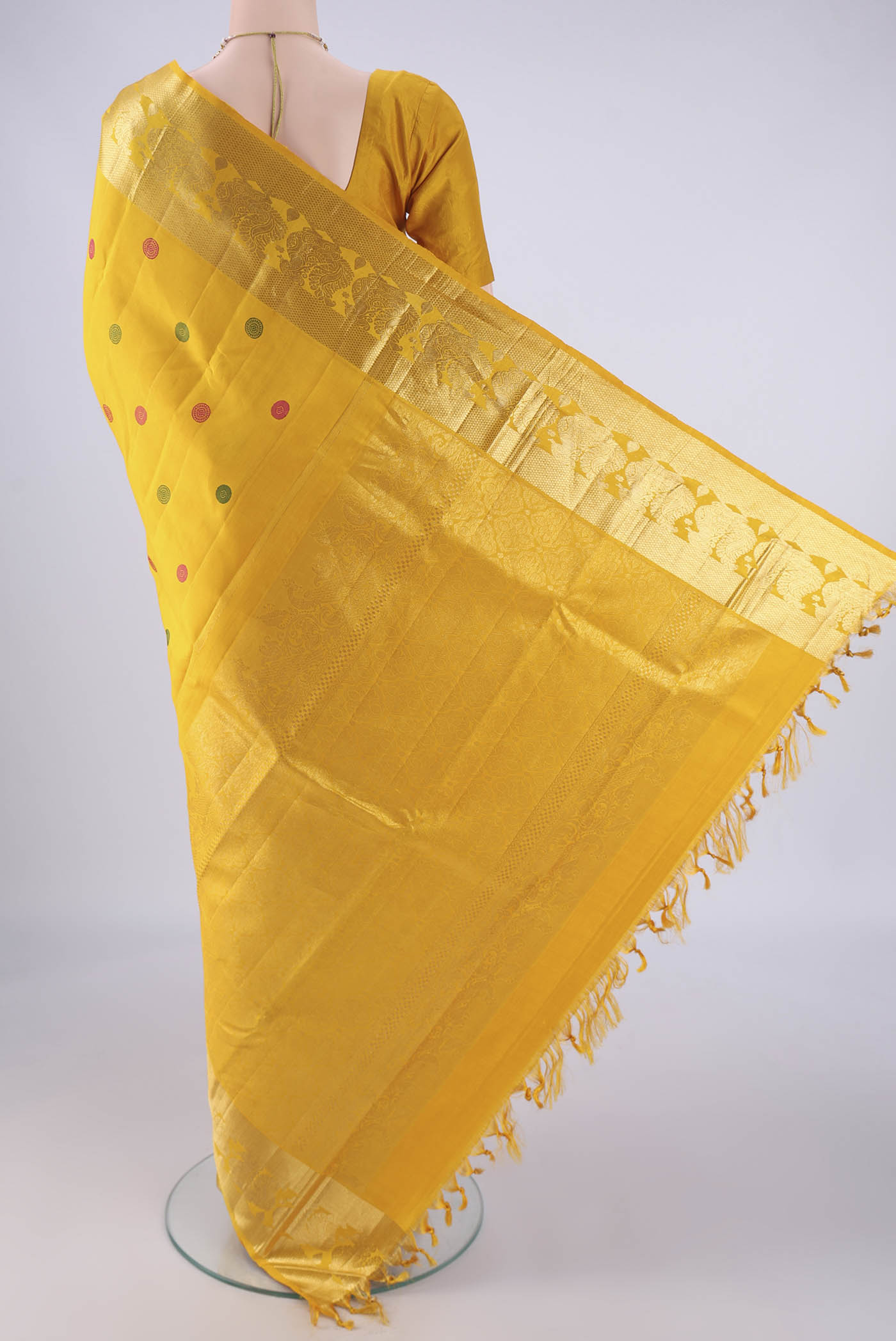 Flat view of Mustard Dual Tone Kanjivaram Silk Saree with Thread Butta on the body and Zari Border. 