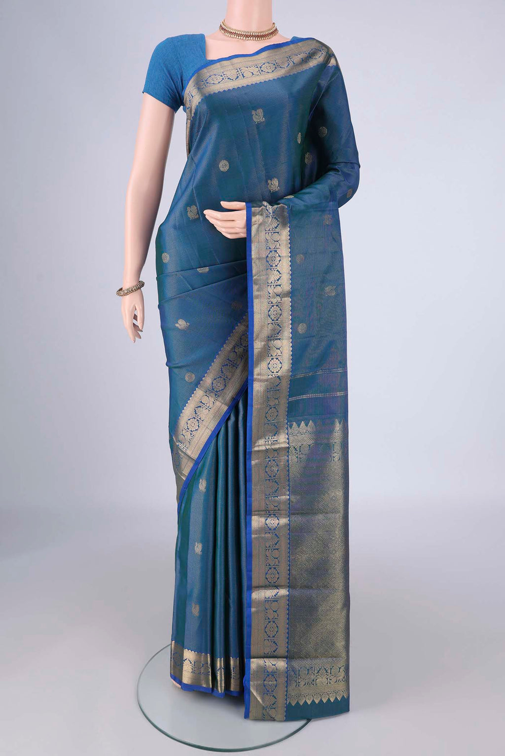 Blue Kanjivaram Silk Saree with Zari Brocade on the body and Zari Border.  displayed on a mannequin