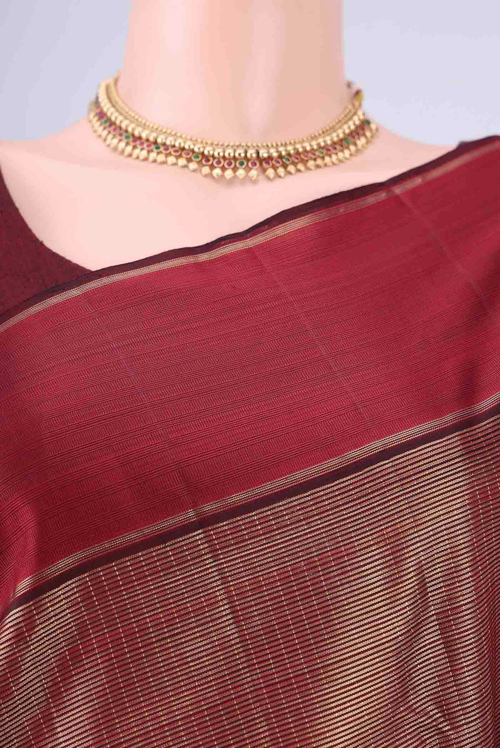 Border image of Maroon Kanjivaram Silk Saree with Zari Brocade on the body and Zari Border. 
