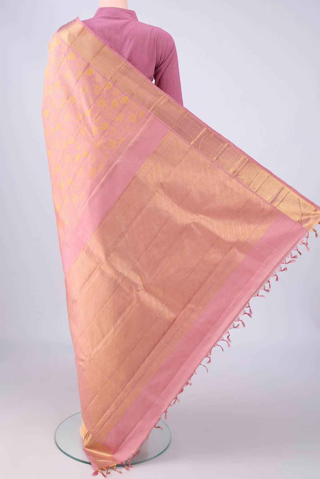 Flat view of Rose pink Kanjivaram Silk Saree with Jacquard design on the body and Zari Border. 