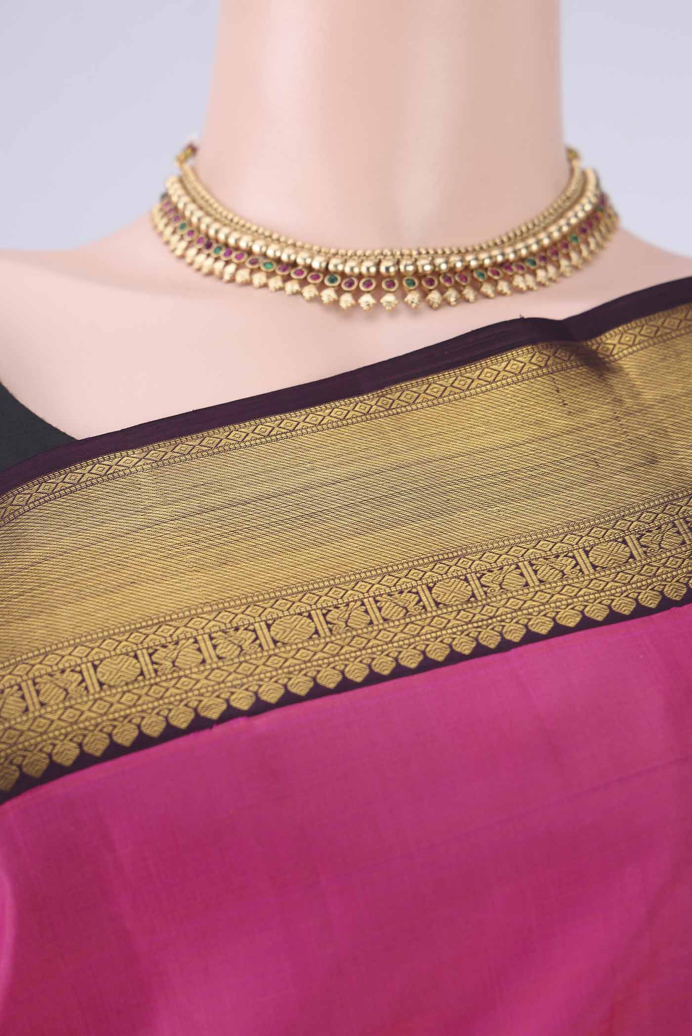 Border image of Pink Dual Tone Kanjivaram Silk Saree with Plain Body and Zari Border. 