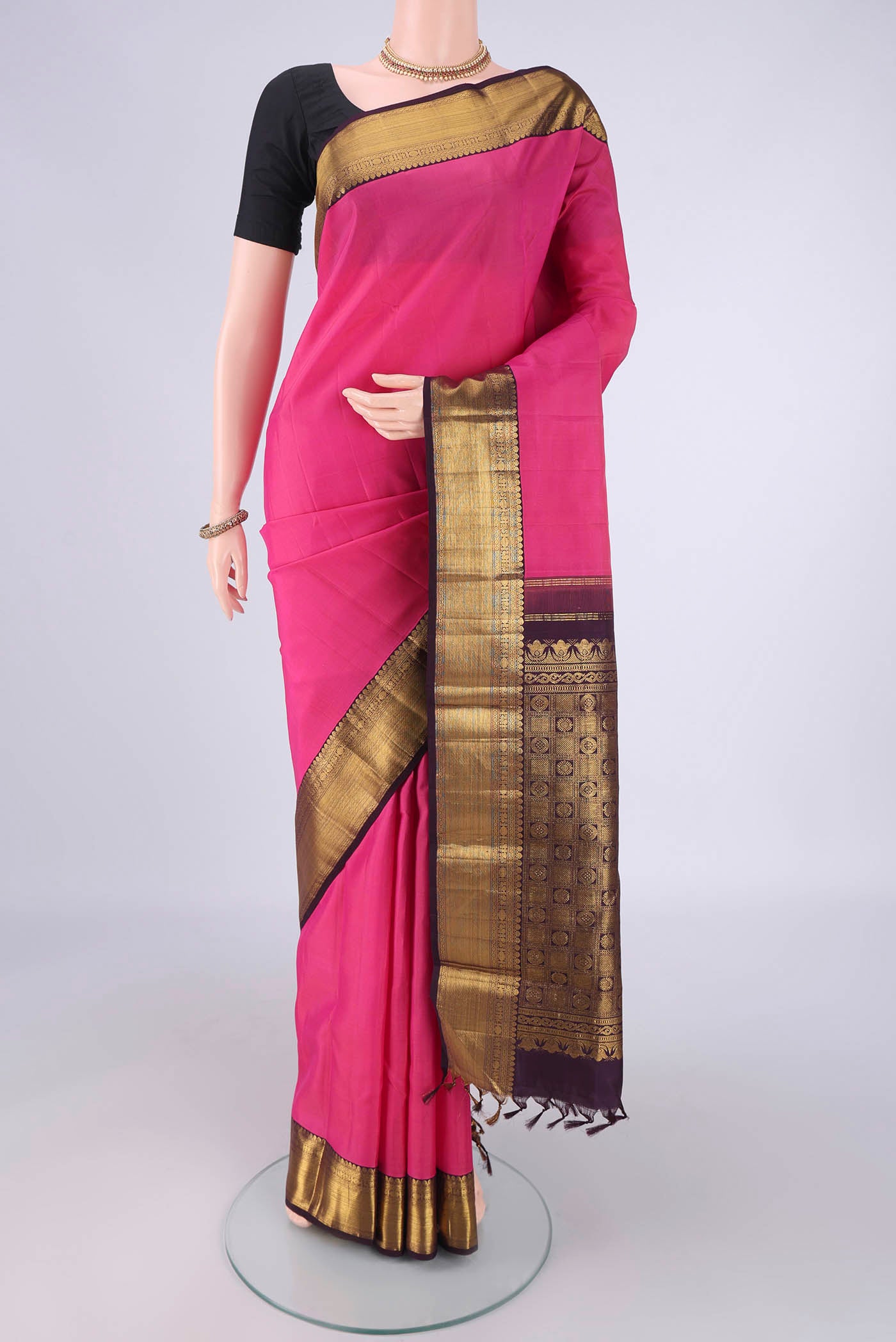 Pink Dual Tone Kanjivaram Silk Saree with Plain Body and Zari Border.  displayed on a mannequin