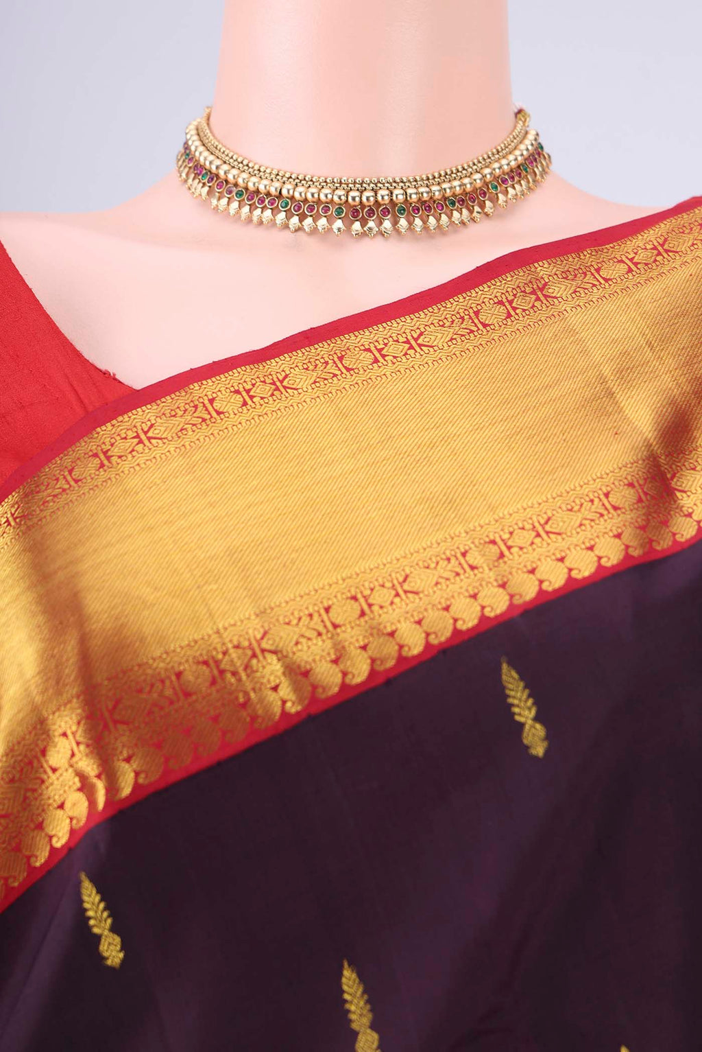 Border image of Brown Dual Tone Kanjivaram Silk Saree with Zari Butta on the body and Zari Border. 