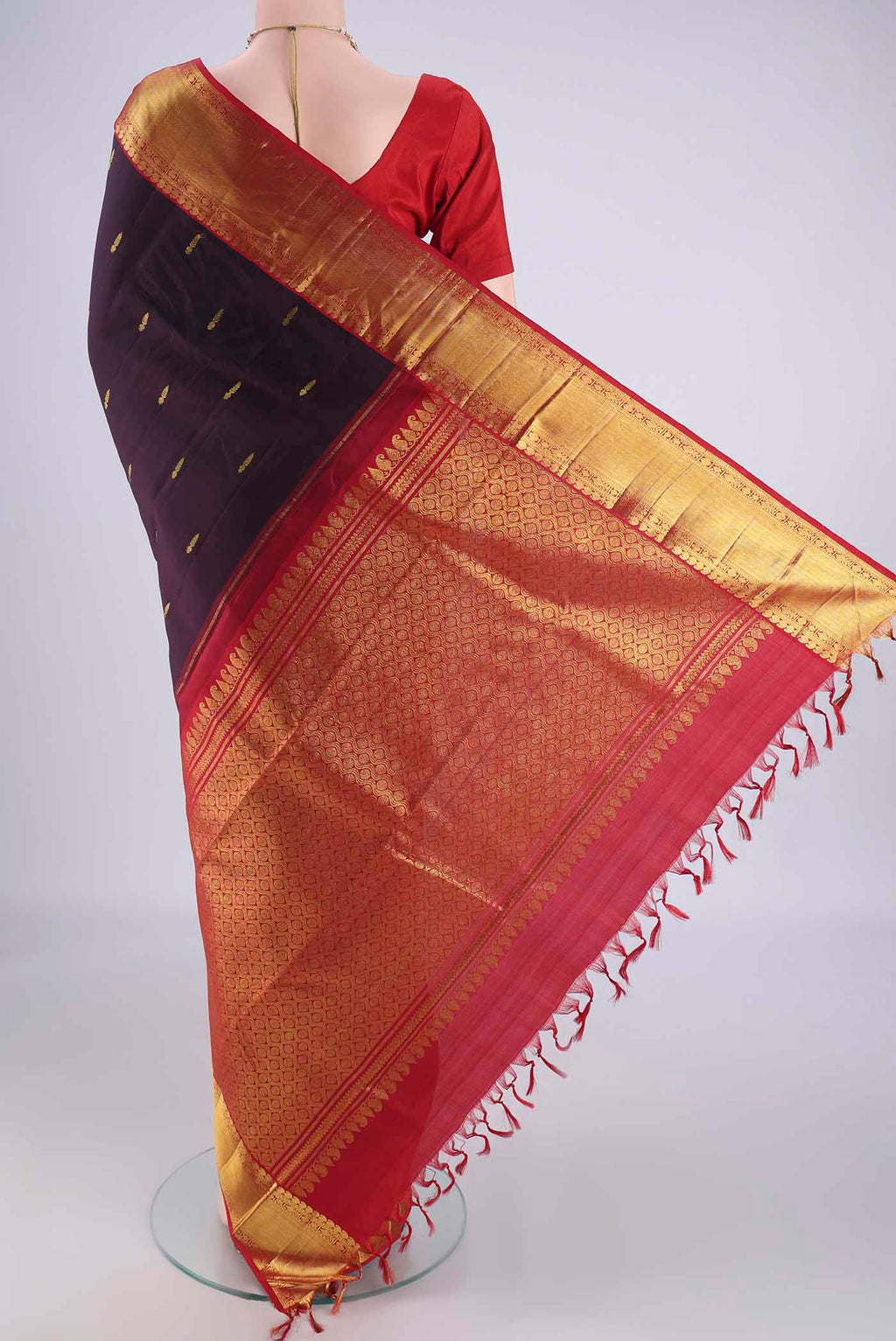 Flat view of Brown Dual Tone Kanjivaram Silk Saree with Zari Butta on the body and Zari Border. 
