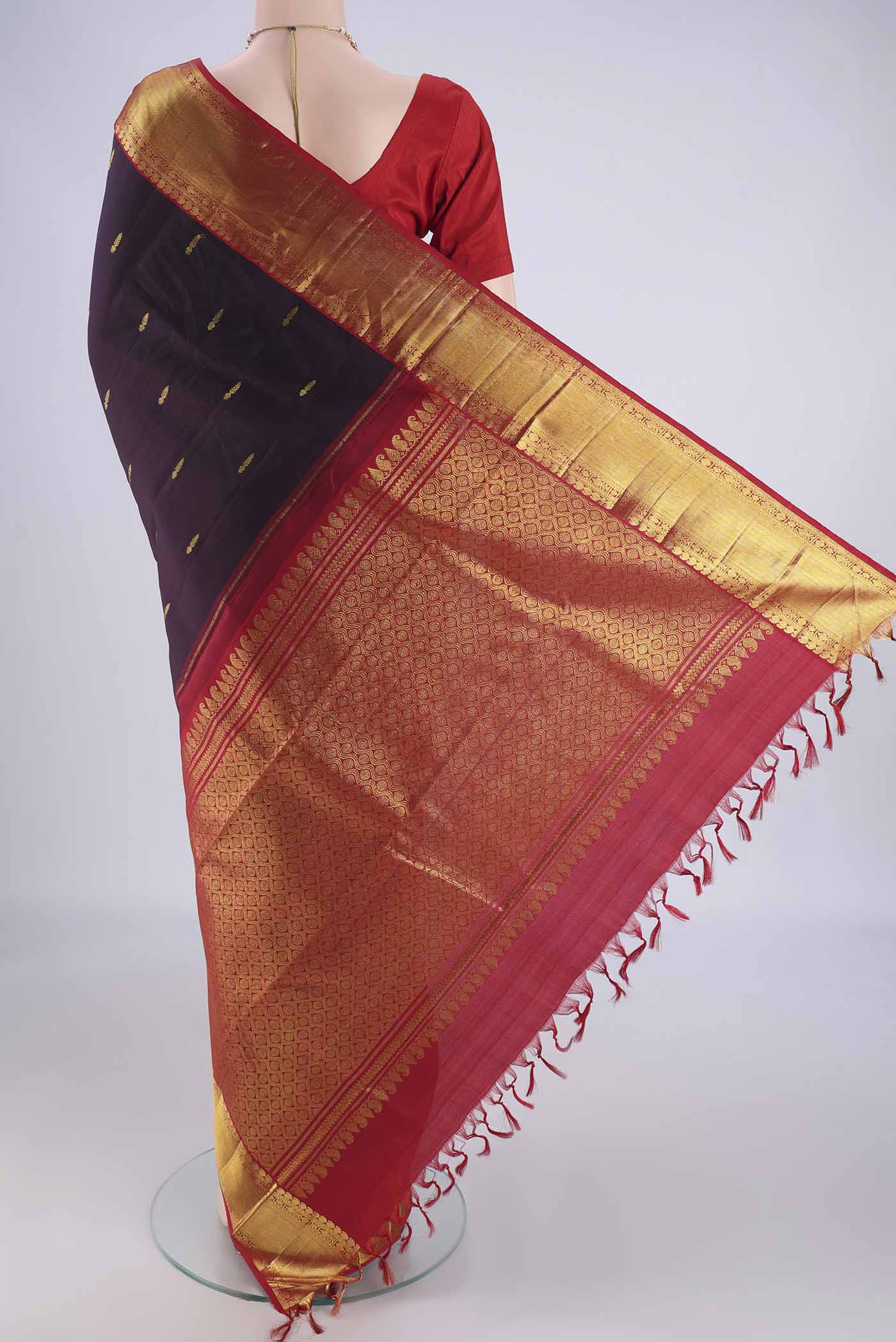 Flat view of Brown Dual Tone Kanjivaram Silk Saree with Zari Butta on the body and Zari Border. 