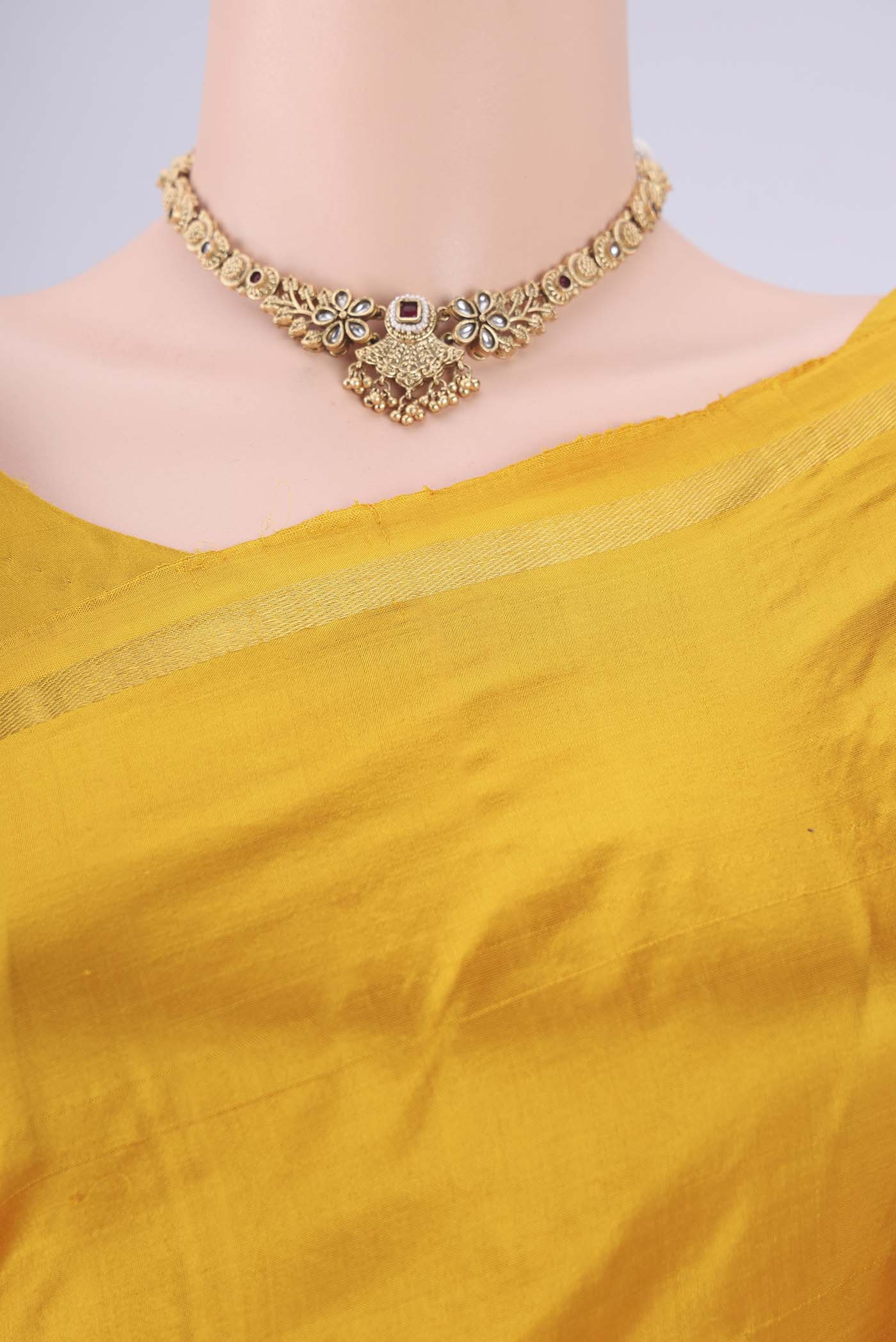 Border image of Yellow Kanchipuram Silk Saree with Thread Butta on the body and Zari Border. 