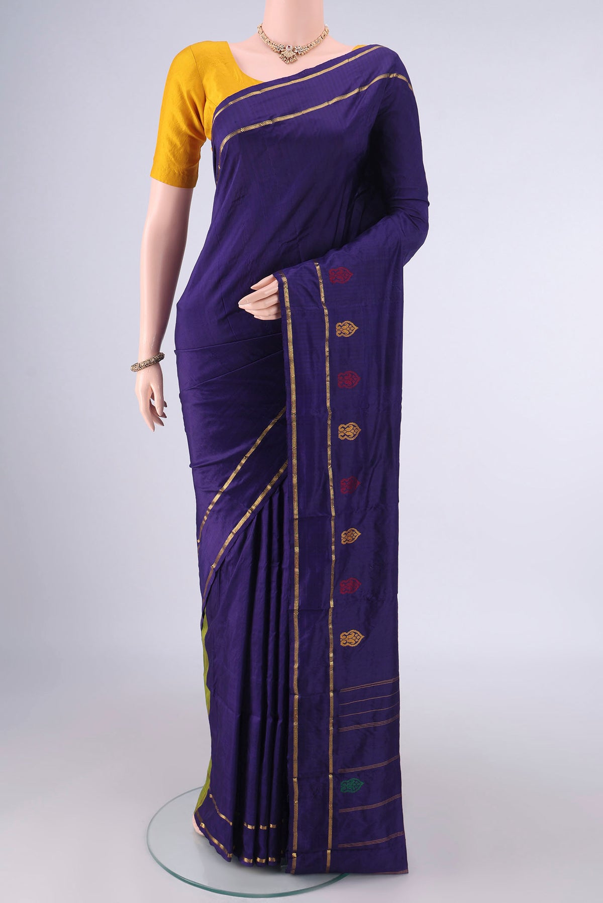 Pure Silk Navy Blue Kanchipuram Saree with Plain Body and Zari Border.  displayed on a mannequin