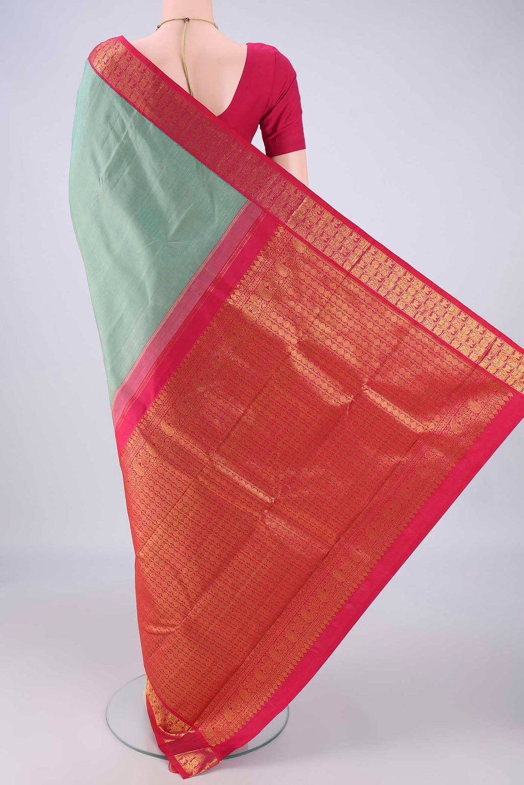 Flat view of Pista Green Kanjivaram Silk Saree with Checked design on the body and Zari Border. 