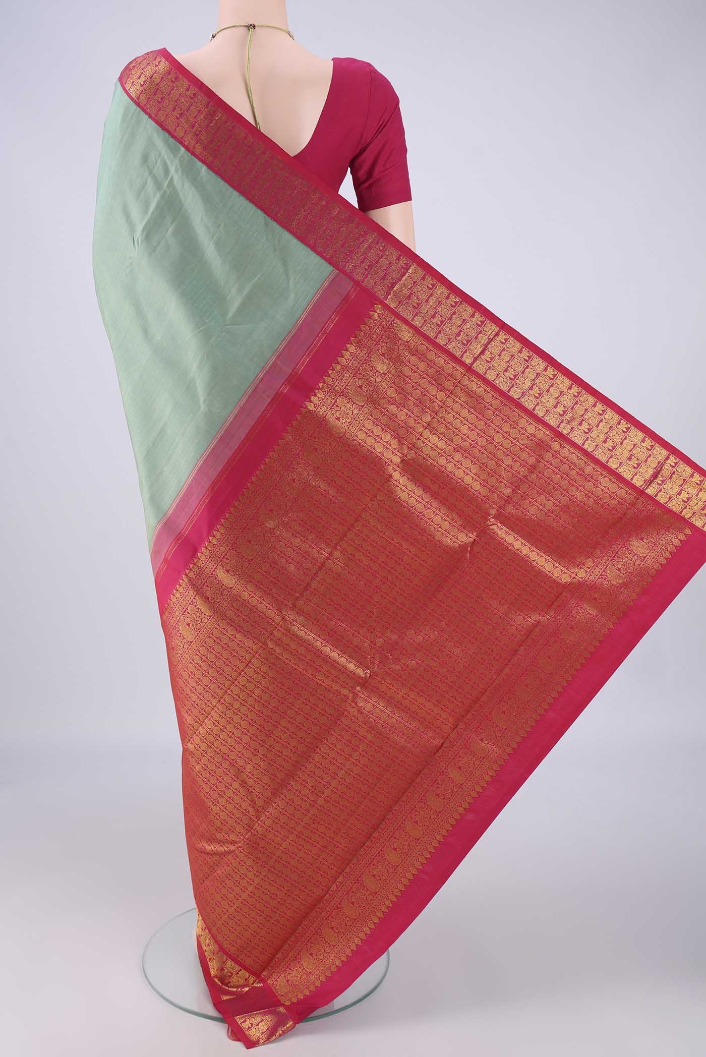Flat view of Pista Green Kanjivaram Silk Saree with Checked design on the body and Zari Border. 