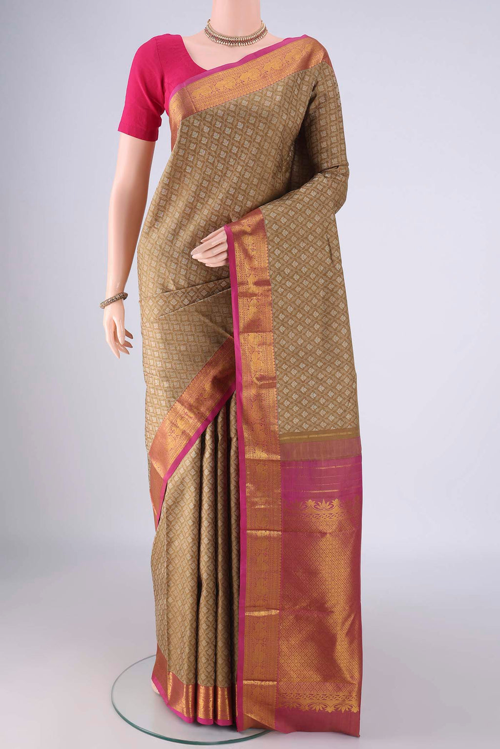 Brown Kanjivaram Silk Saree with Jacquard With Zari Butta on the body and Zari Border.  displayed on a mannequin