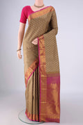 Brown Kanjivaram Silk Saree with Jacquard With Zari Butta on the body and Zari Border.  displayed on a mannequin