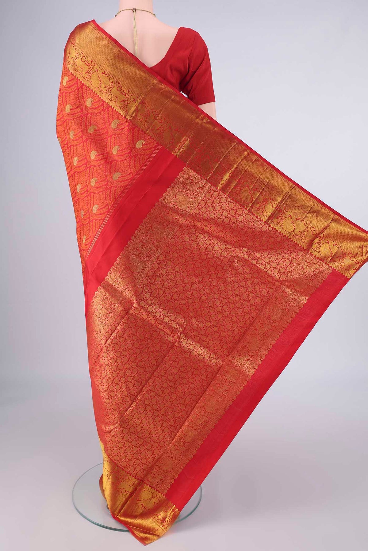 Flat view of Pure Silk Red Kanjivaram Saree with Jacquard With Zari Butta on the body and Zari Border. 