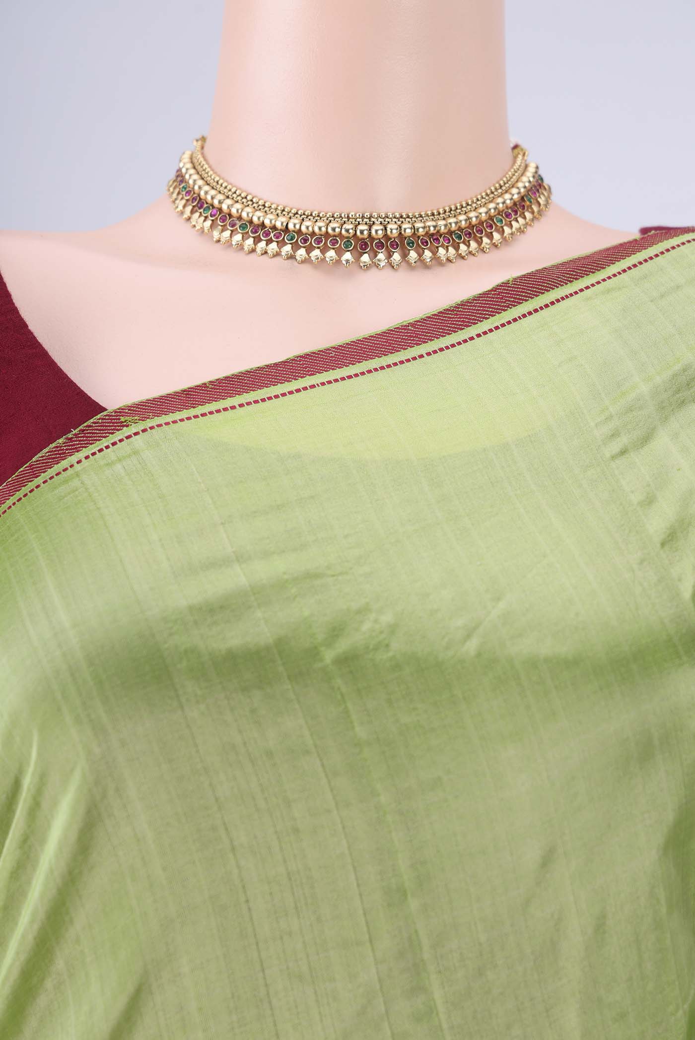 Border image of Green Kanchipuram Silk Saree with Plain Body and Thread Border. 
