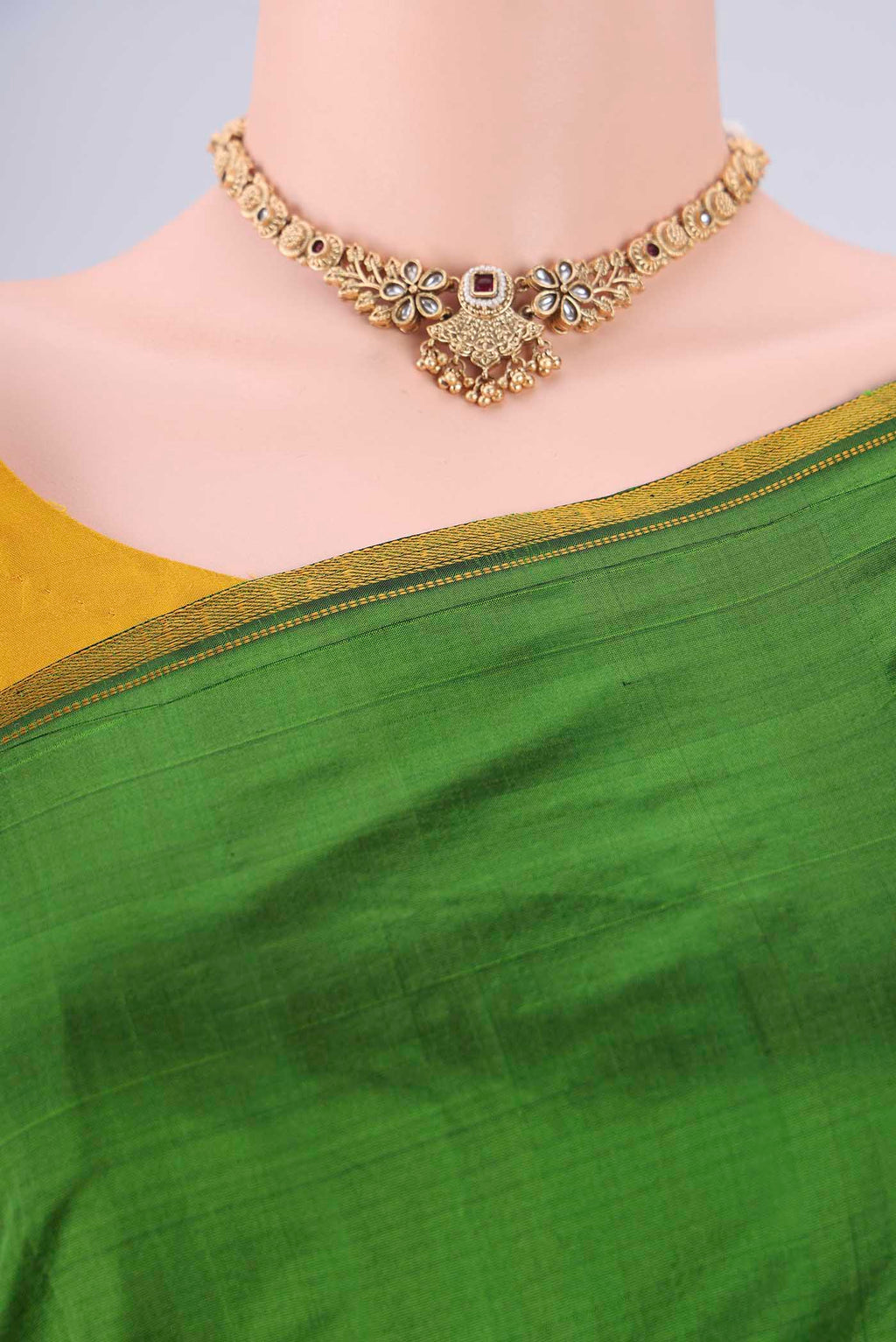 Border image of Green Kanchipuram Silk Saree with Plain Body and Thread Border. 