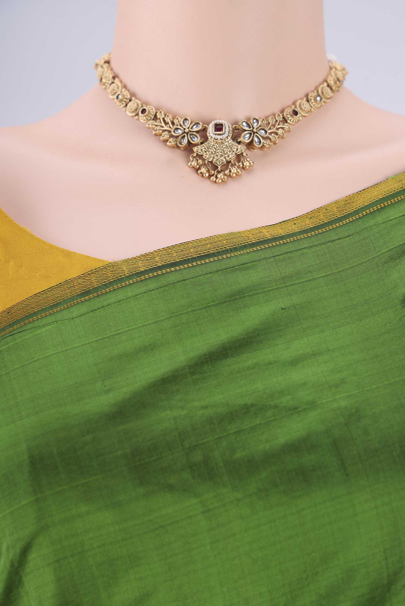 Border image of Green Kanchipuram Silk Saree with Plain Body and Thread Border. 