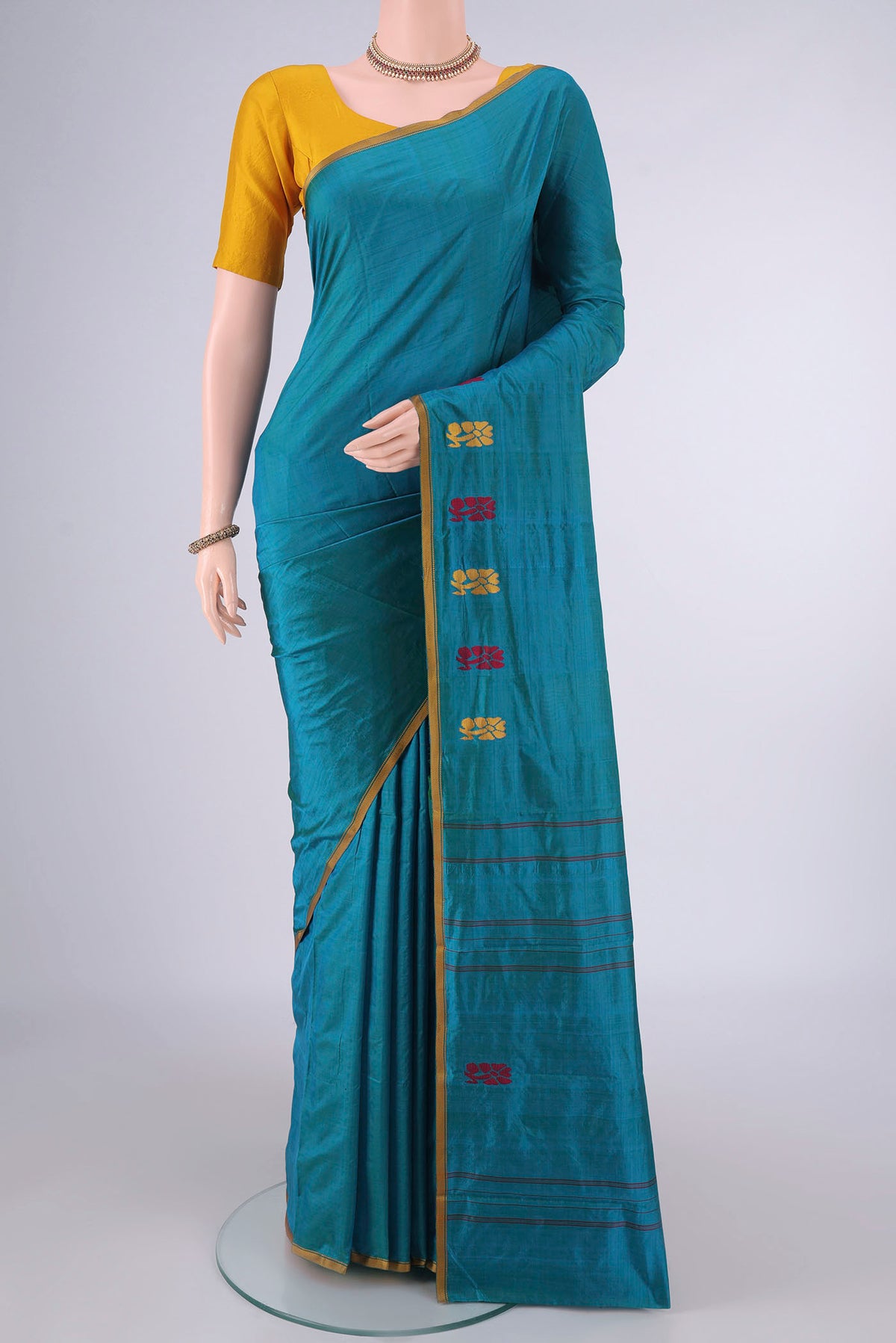 Pure Silk Sea Green Kanchipuram Saree with Plain Body and Thread Border.  displayed on a mannequin