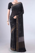 Black Mysore Crepe Saree with Printed design on the body and Zari Border.  displayed on a mannequin
