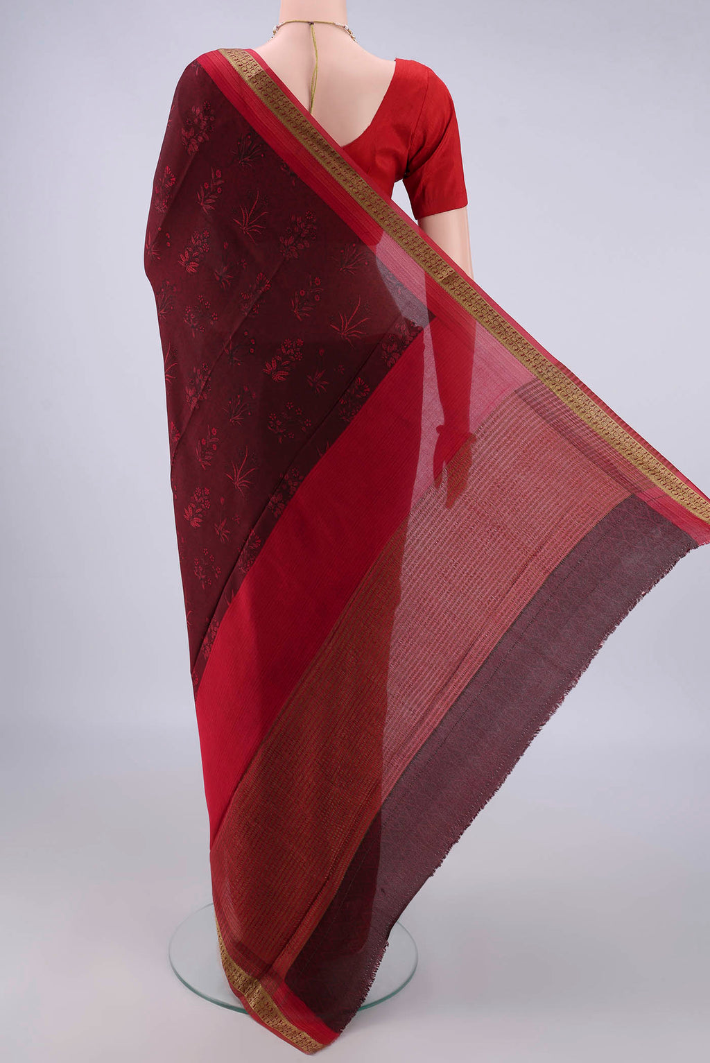 Flat view of Maroon Mysore Crepe Saree with Printed design on the body and Zari Border. 