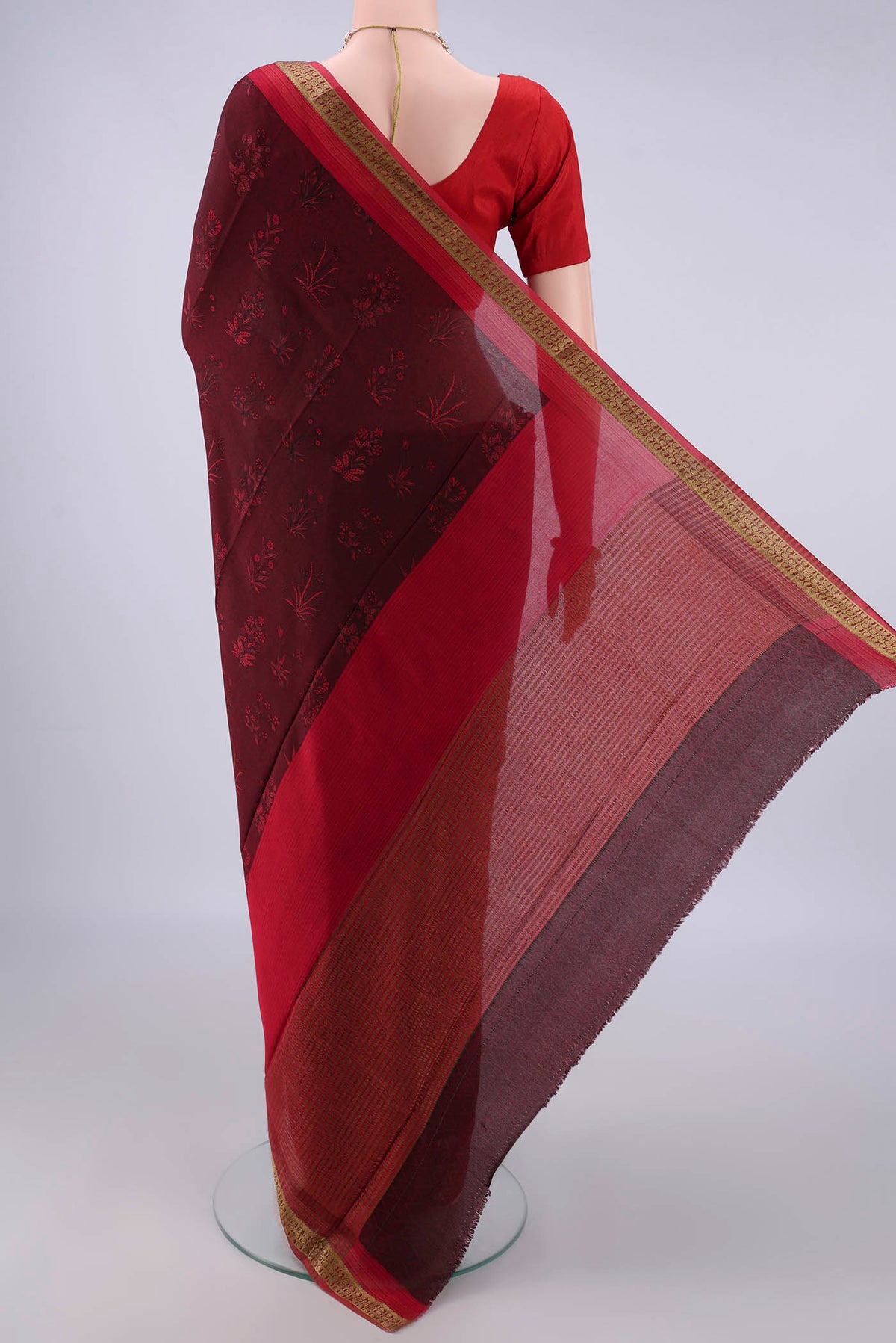 Flat view of Maroon Mysore Crepe Saree with Printed design on the body and Zari Border. 