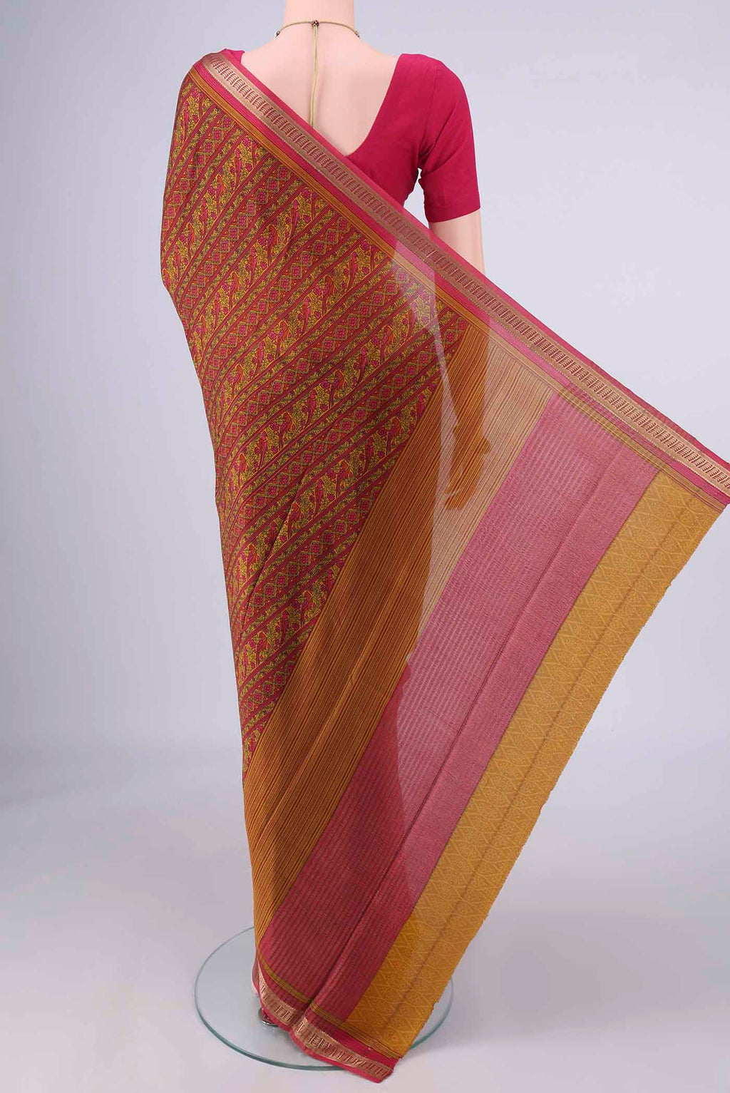 Flat view of Mustard Mysore Crepe Saree with Printed design on the body and Zari Border. 