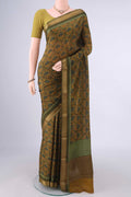 Mehandi Green Mysore Crepe Saree with Printed design on the body and Zari Border.  displayed on a mannequin