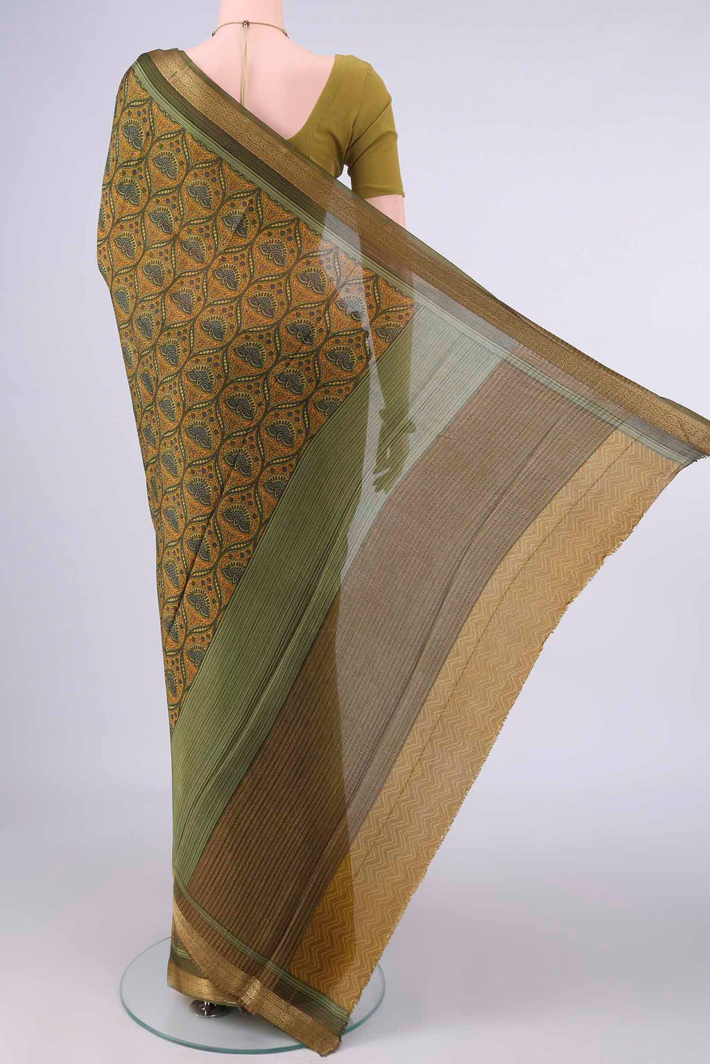 Flat view of Mehandi Green Mysore Crepe Saree with Printed design on the body and Zari Border. 
