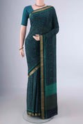 Navy Blue Mysore Crepe Saree with Plain Body and Zari Border.  displayed on a mannequin