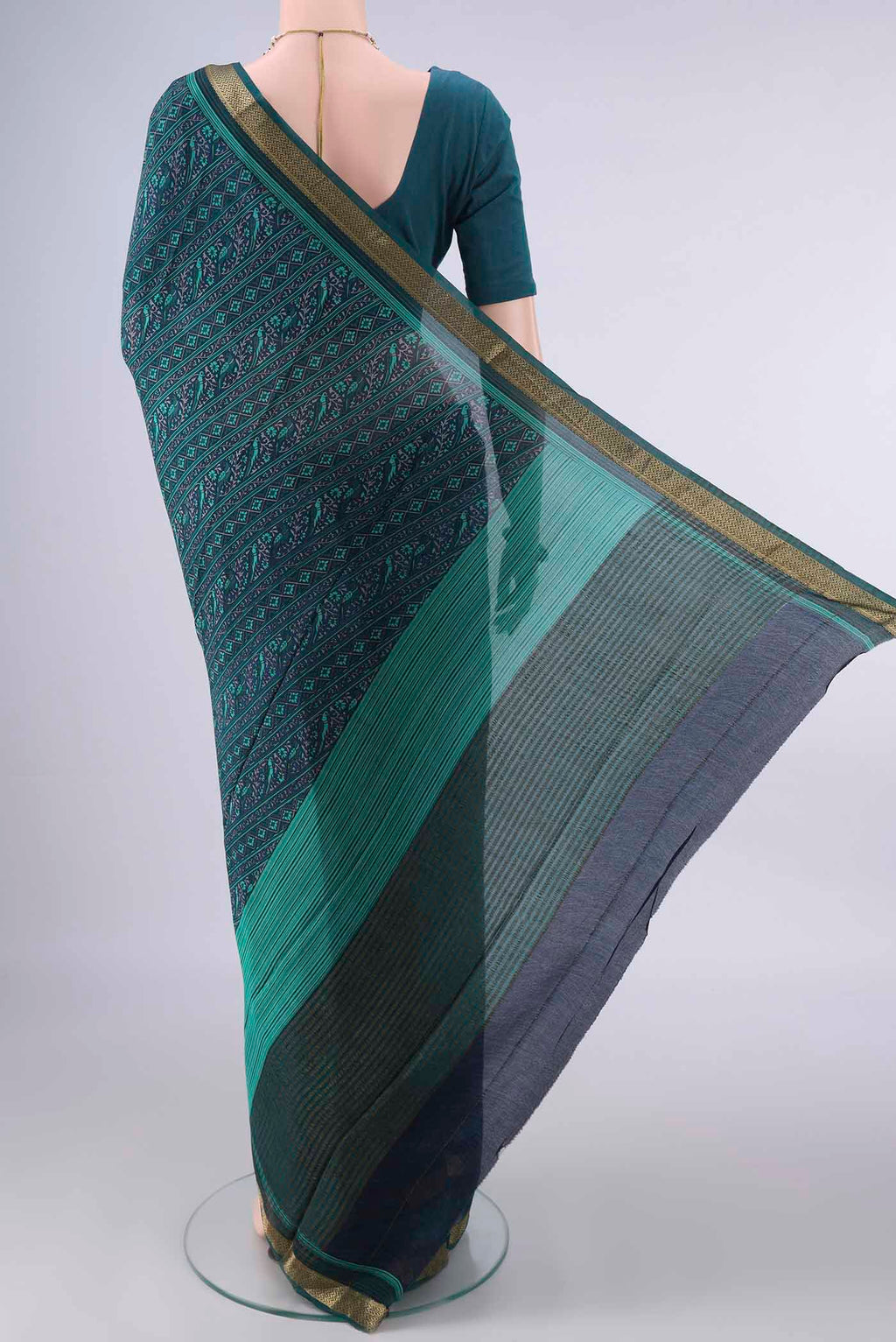 Flat view of Navy Blue Mysore Crepe Saree with Plain Body and Zari Border. 