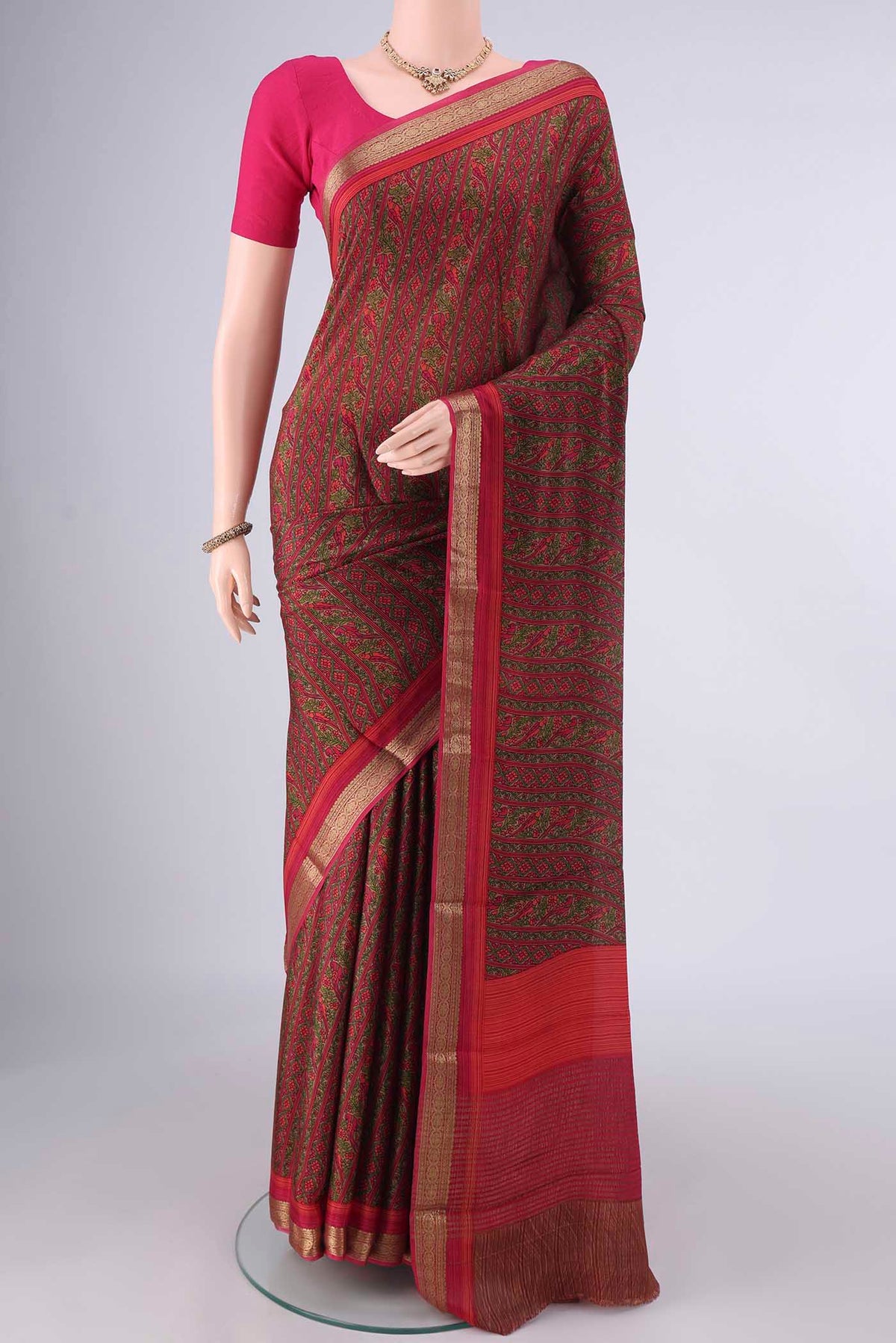 Multi Color Mysore Crepe Saree with Printed design on the body and Zari Border.  displayed on a mannequin