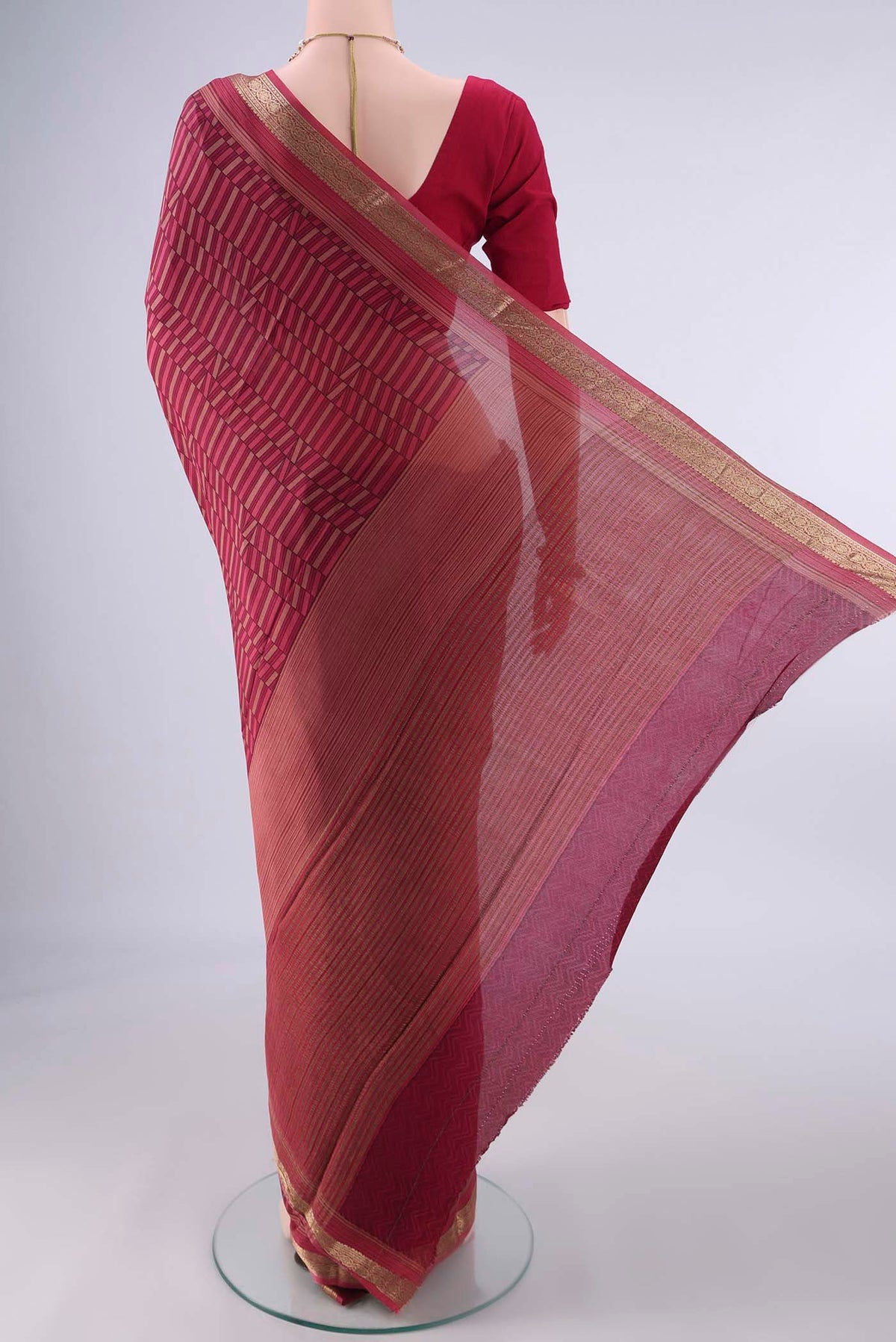 Flat view of Coral Mysore Crepe Saree with Printed design on the body and Printed Border. 