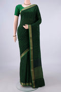Bottle Green Mysore Crepe Saree with Printed design on the body and Zari Border.  displayed on a mannequin