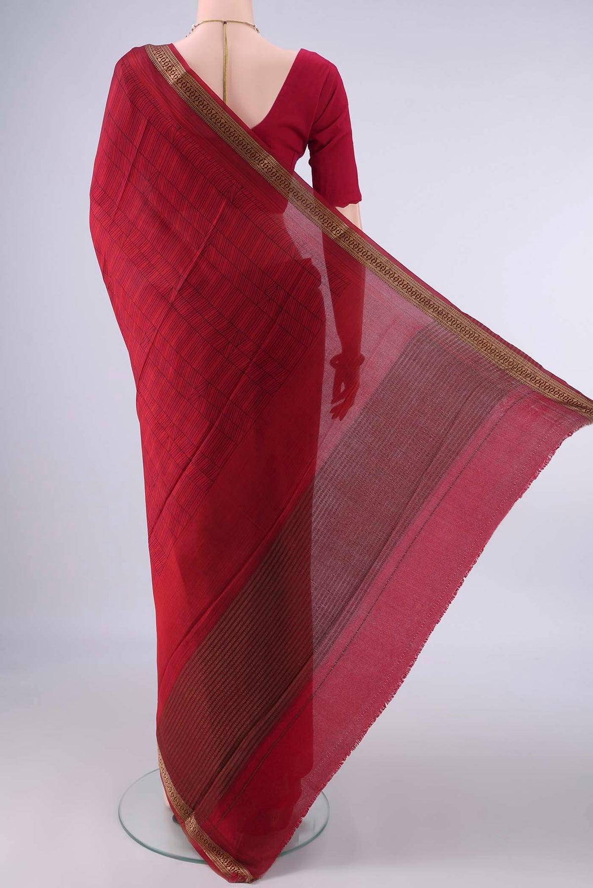 Flat view of Red Mysore Crepe Saree with Printed design on the body and Zari Border. 