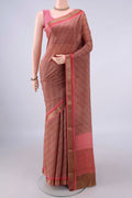 Dark Beige Mysore Crepe Saree with Printed design on the body and Zari Border.  displayed on a mannequin