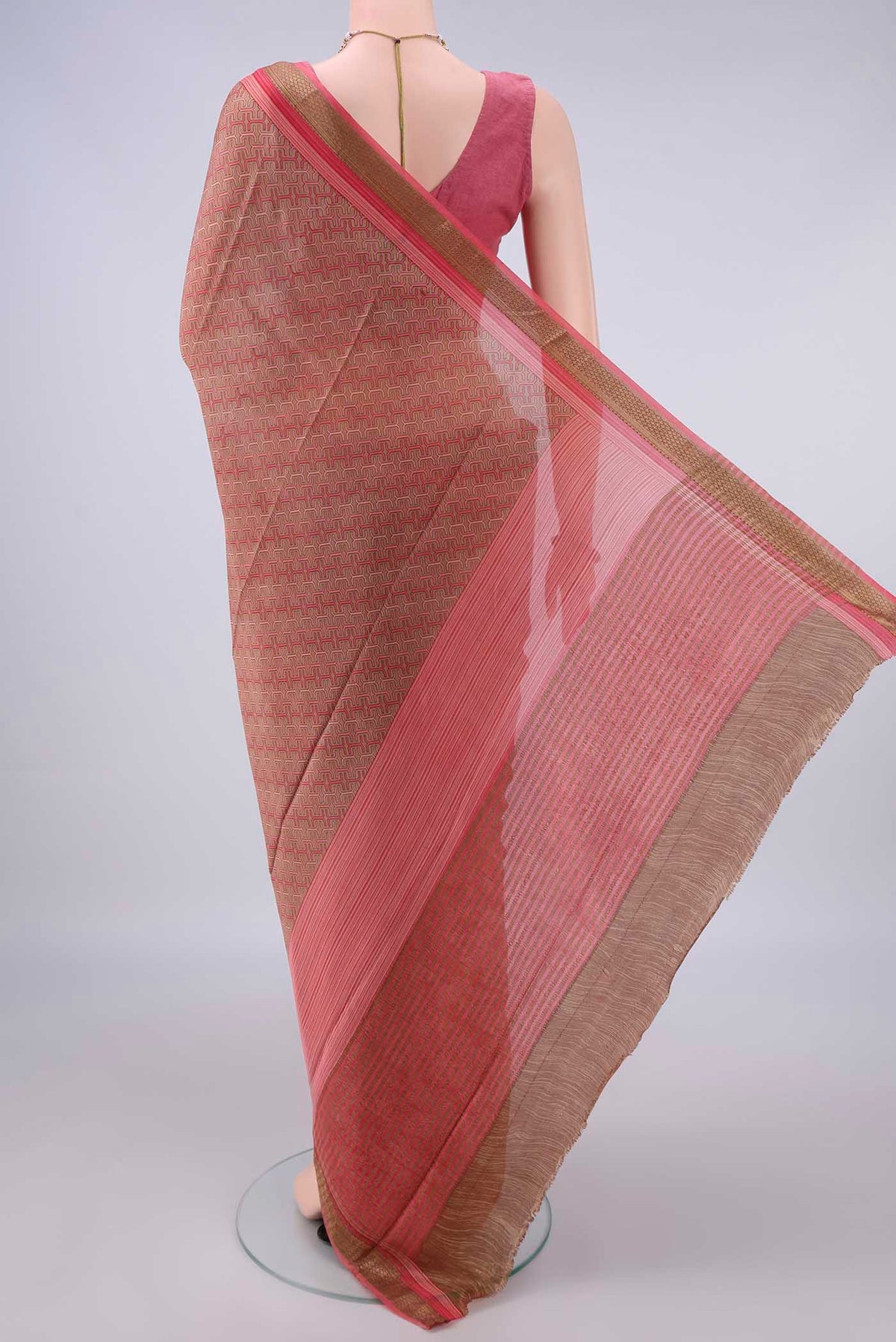Flat view of Dark Beige Mysore Crepe Saree with Printed design on the body and Zari Border. 