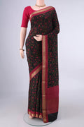 Black Mysore Crepe Saree with Printed design on the body and Zari Border.  displayed on a mannequin