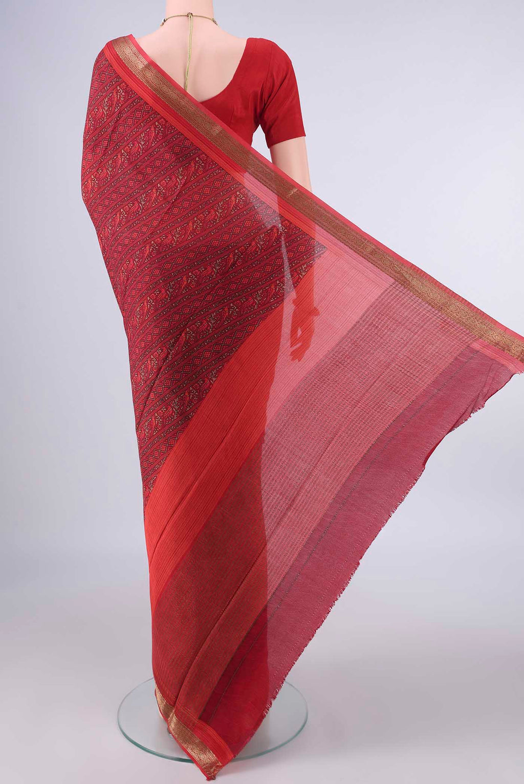 Flat view of Maroon Mysore Crepe Saree with Printed design on the body and Zari Border. 