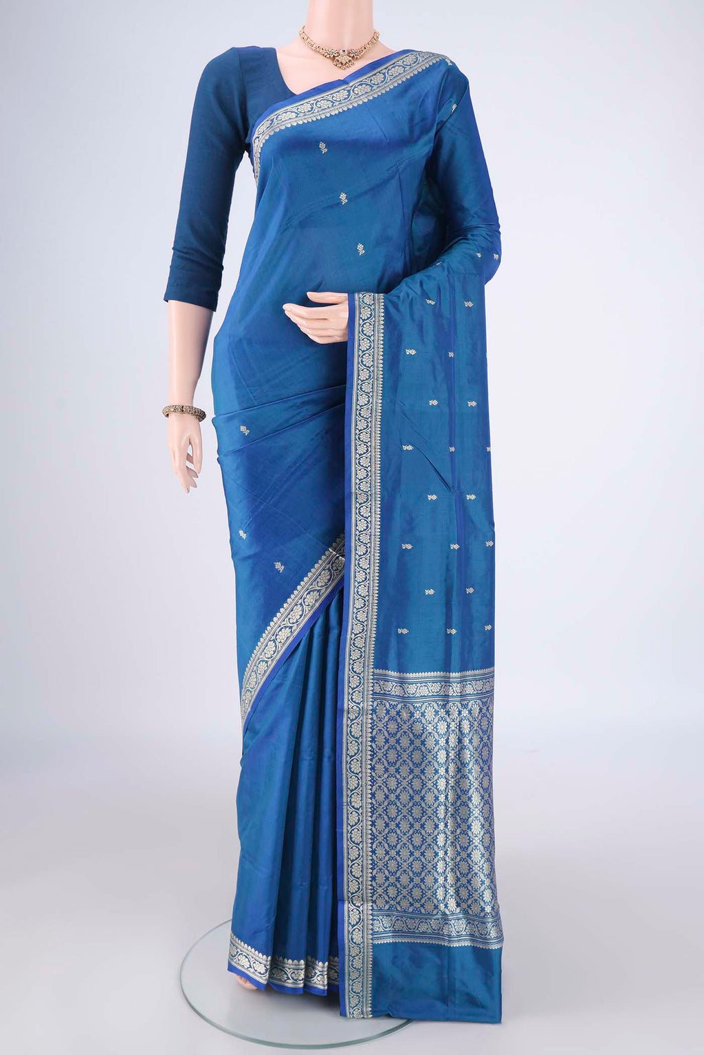 Blue Dual Tone Banarasi Katan Silk Saree with Thread Butta on the body and Thread Border.  displayed on a mannequin
