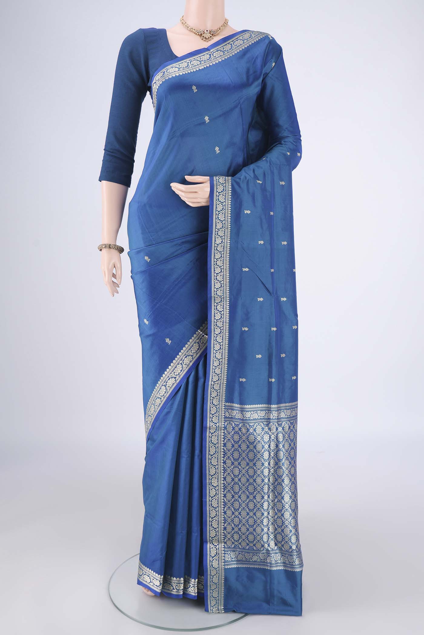 Blue Dual Tone Banarasi Katan Silk Saree with Thread Butta on the body and Thread Border.  displayed on a mannequin