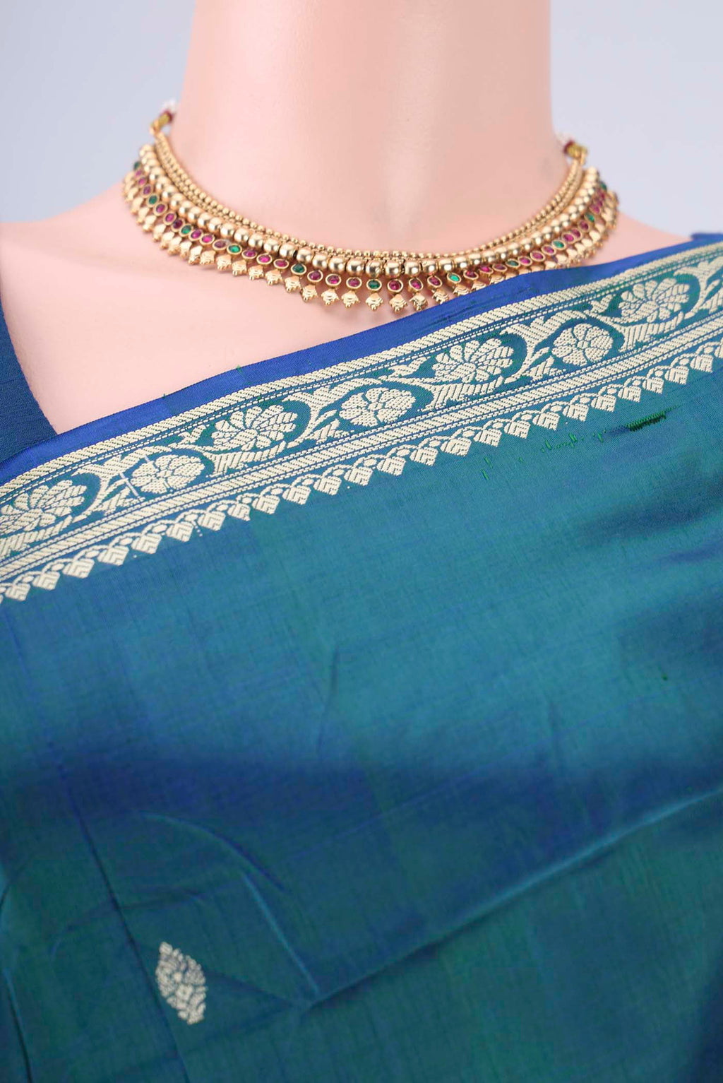 Border image of Peacock Blue Banarasi Silk Saree with Thread Butta on the body and Thread Border. 