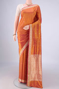 Rust Banarasi Silk Saree with Thread Butta on the body and Thread Border.  displayed on a mannequin