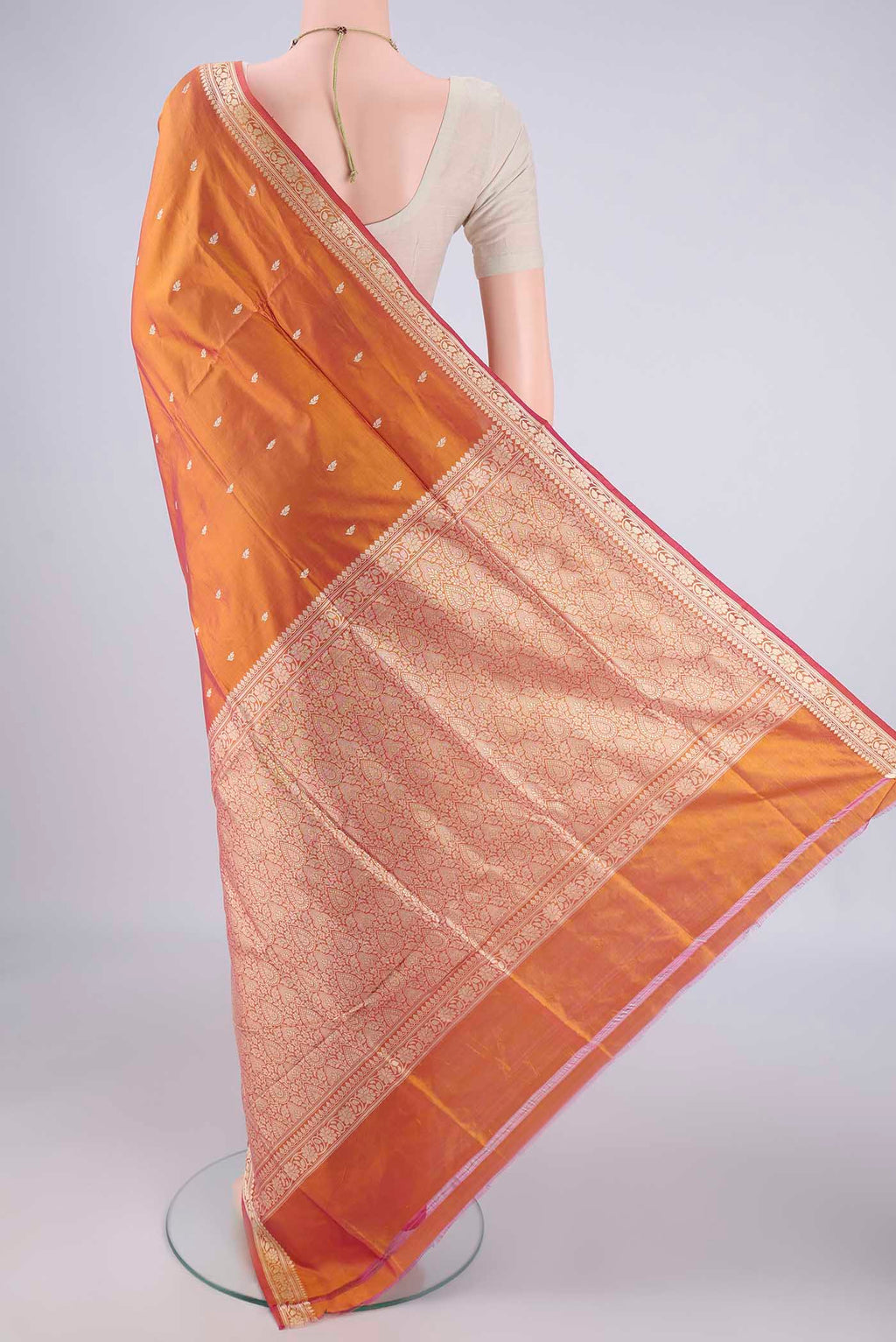 Flat view of Rust Banarasi Silk Saree with Thread Butta on the body and Thread Border. 