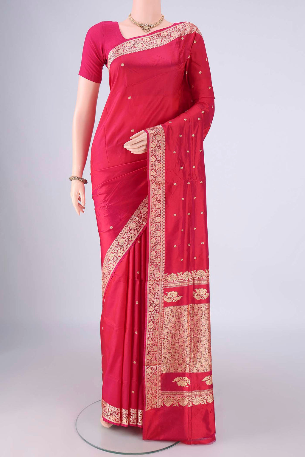 Dark Pink Banarasi Silk Saree with Thread Butta on the body and Thread Border.  displayed on a mannequin