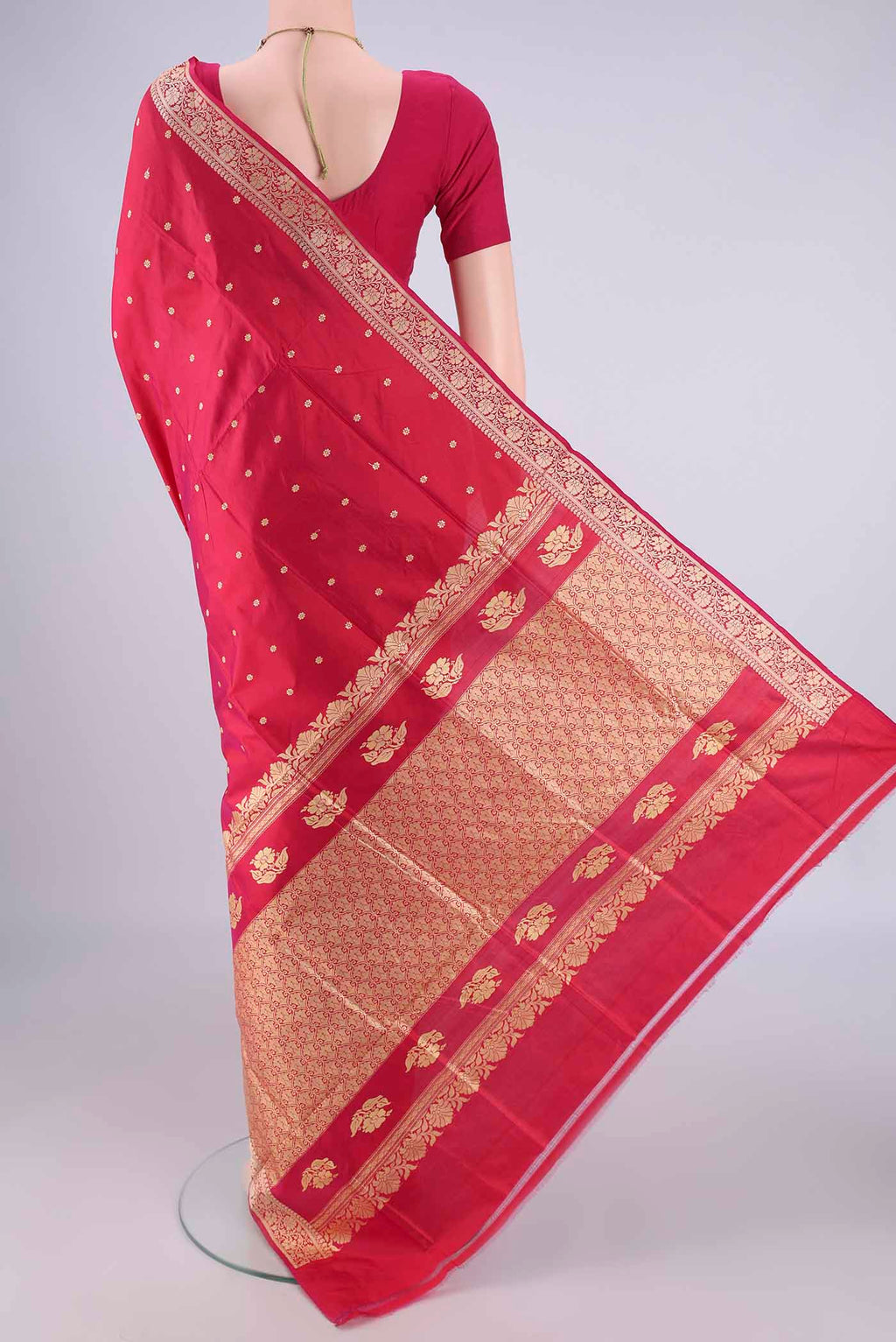 Flat view of Dark Pink Banarasi Silk Saree with Thread Butta on the body and Thread Border. 