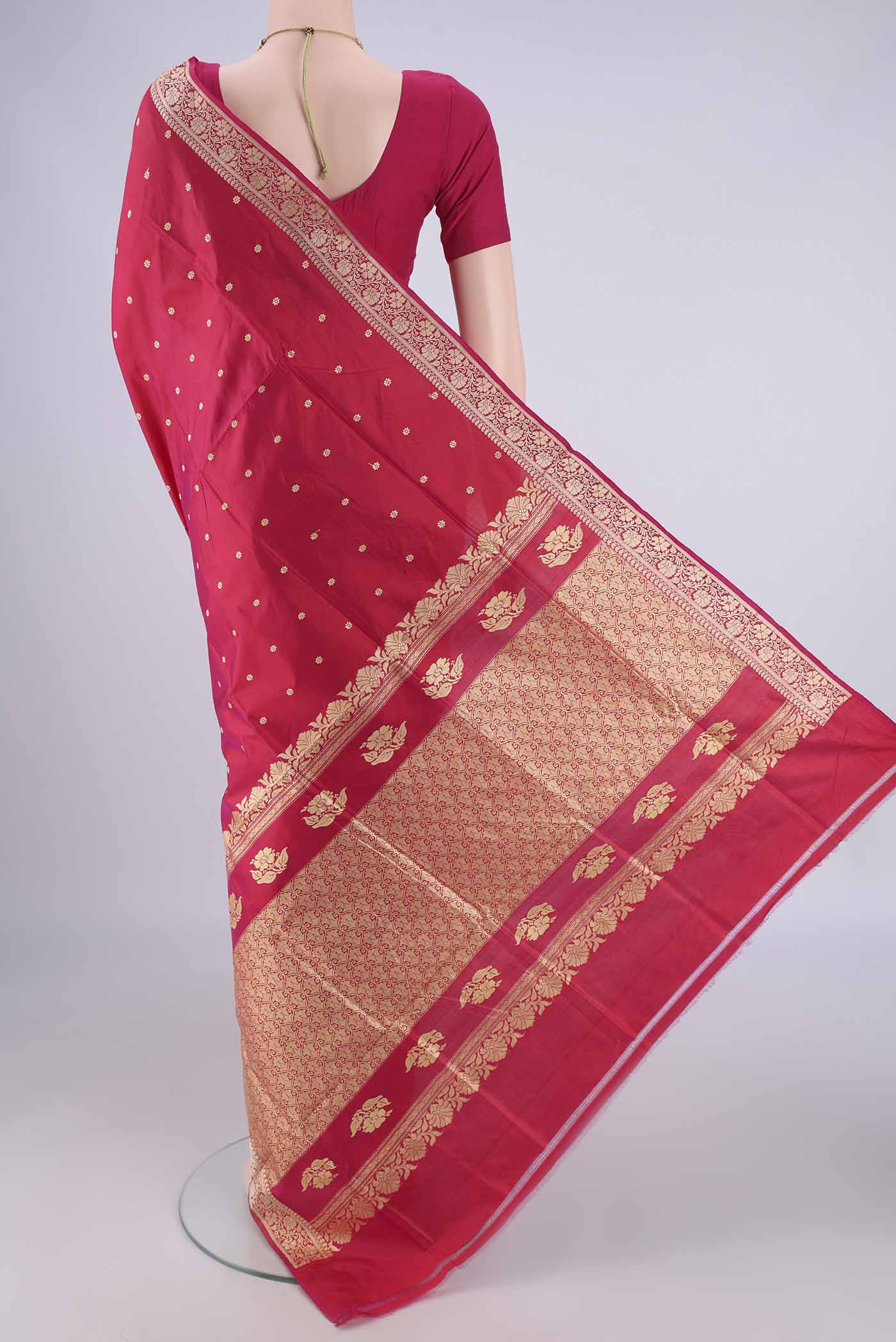 Flat view of Dark Pink Banarasi Silk Saree with Thread Butta on the body and Thread Border. 