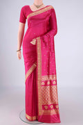 Rani Pink Banarasi Katan Silk Saree with Thread Butta on the body and Thread Border.  displayed on a mannequin